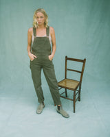 Olive dungarees on Alice